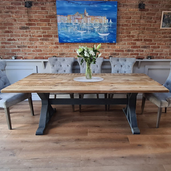 Black industrial style dining table made from salvaged timber