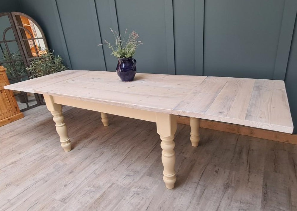 The Holkam whitewashed dining table with two removable extensions