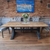 Black industrial style dining table made from salvaged timber