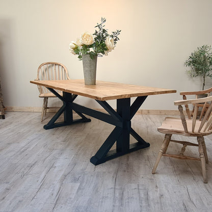 The Cross frame trestle table (pictured with the rustic pine finish)