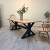 The Cross frame trestle table (pictured with the rustic pine finish)