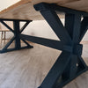 The Cross frame trestle table (pictured with the rustic pine finish)